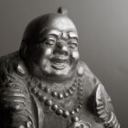 Gelukssymbolen: de Lachende en de Huilende Boeddha